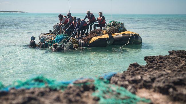 Photo of marine debris removal near Midway Atoll (Kuaihelani, Pihemanu) during the 2018 marine debris removal mission.