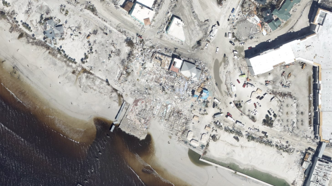 Aerial imagery from NOAA's National Geodetic Survey of damage in the Times Square district of Fort Myers Beach, Fla., after Category 4 Hurricane Ian struck the area.