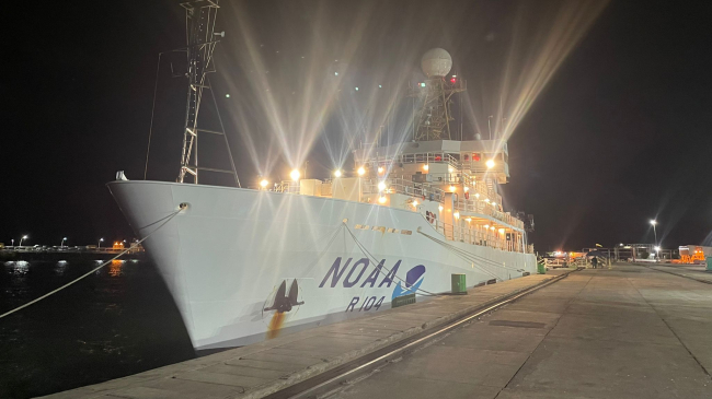 Picture of the NOAA ship Ronald Brown with its lights on in port at night in Brazil: March, 2023.