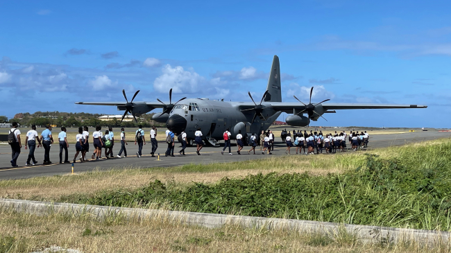 Image showing students lining up to board the U.S. Air Force Reserve Hurricane Hunter aircraft in St. Thomas, U.S. Virgin Islands during the 2022 Caribbean Hurricane Awareness Tour