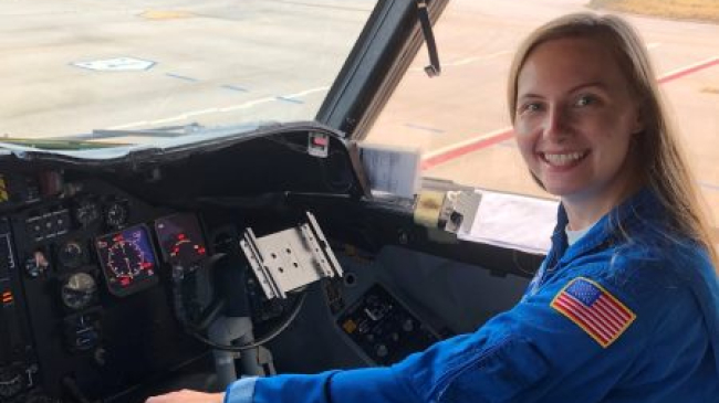 AOML/CIMAS communication intern Holly Stahl in the cockpit of a NOAA P-3 Hurricane Hunter aircraft.