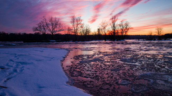 Photo showing chunks of ice float in the James River on January 29, 2014, in Richmond, Virginia. A rare winter storm has brought ice and snow across the southern states, closing schools and stranding motorists.