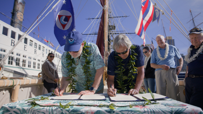 Image showing NOAA Administrator Rick Spinrad, Ph.D., and Polynesian Voyaging Society CEO Nainoa Thompson signed the MOU in San Diego, California, aboard Hōkūle‘a.