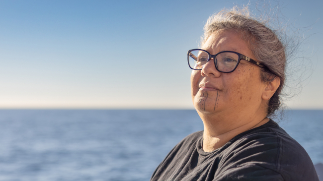 Mia Lopez of the Coastal Band of the Chumash Nation looks out on her ancestral waters from the deck of NOAA Ship Okeanos Explorer during the 2023 EXPRESS: Exploration of Central California Coast expedition.