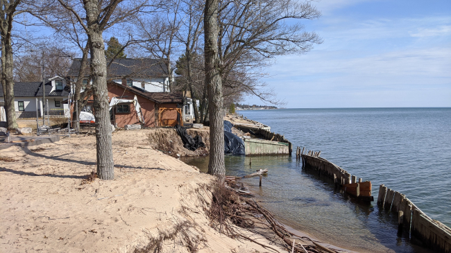 Photo showing High water levels encroach on seawalls and lakeside property near the town of Oscoda, Michigan on Lake Huron in April 2020 (Gabrielle Farina, NOAA GLERL).