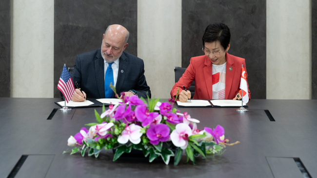 Photo showing Under Secretary of Commerce for Oceans and Atmosphere and NOAA Administrator Rick Spinrad, Ph.D. and Singapore Minister for Sustainability and the Environment and Minister-in-charge of Trade Relations Ms. Grace Fu signed an MOU to enhance bilateral cooperation on environmental management and climate protection in Singapore on April 15, 2024. 