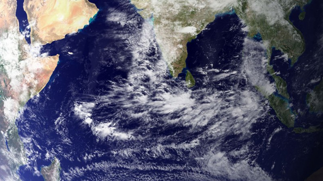 View of Earth from a satellite showing India with cloud cover.