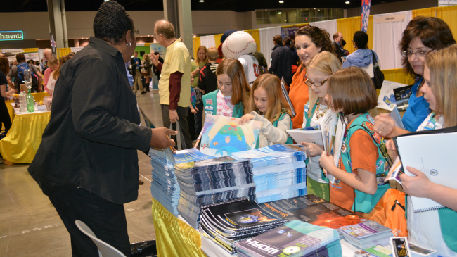 Education and Outreach Specialist Nina Jackson educates kids about NOAA Satellite and Information Service and provides educational material on weather, satellites, climate and the environment at the NOAA booth during the American Meteorological Society's WeatherFest event. 