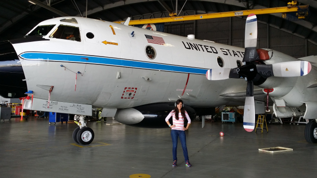 EPP/MSI Undergraduate Scholar Kelly Nunez with NOAA Hurricane Hunter plane during her summer internship. 