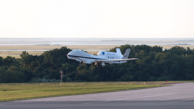 NASA’s remotely piloted Global Hawk departs from Wallops Flight Facility in Virginia at 7 a.m., August 26, on a 24 hour flight that successfully transmitted weather data to NOAA’s hurricane forecast model from Tropical Storm Erika. The aircraft carries instruments to measure temperature, moisture, wind speed and direction as part of the NOAA- led mission Sensing Hazards with Operational Unmanned Technology (SHOUT).