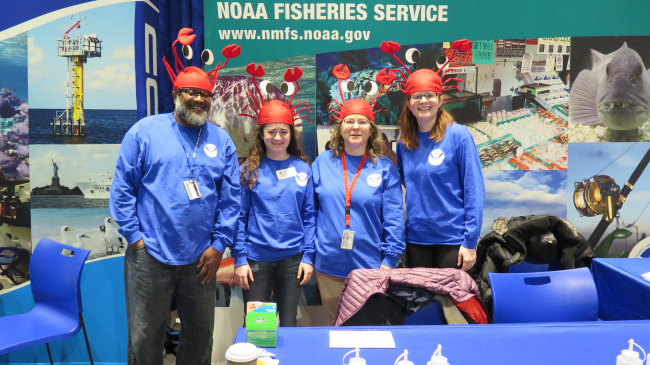 Staff volunteers from NOAA Fisheries Service ready for a full day of fun, hands-on science activities at the 2018 NOAA Open House in Silver Spring, Maryland.