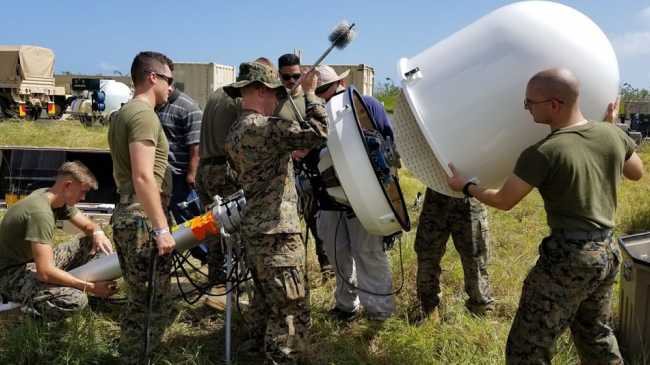 Hurricane Maria Federal Response: U.S. military personnel collaborate with NOAA to install temporary DOD mobile radars in Roosevelt Roads and Aguadilla, Puerto Rico, to assist weather forecasting while the permanent FAA radars are under repair.