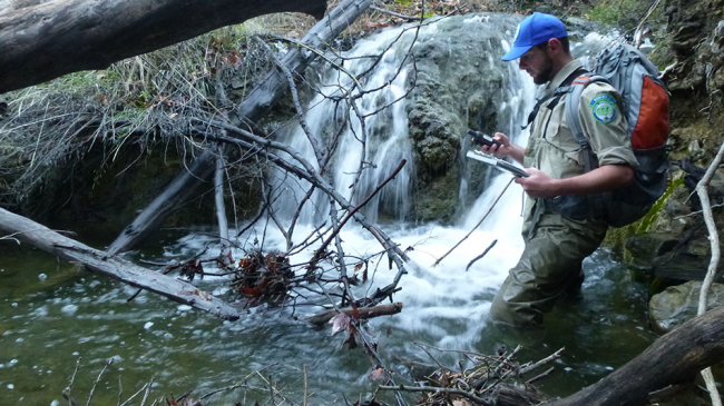 Veteran Dustin Casey conducts a survey on Manzana Creek in California.