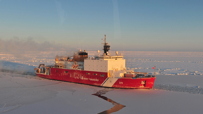 The Coast Guard Cutter Healy cutting a path through ice to allow the Russian oil tanker to make a fuel delivery to Nome, Alaska in December 2012. I