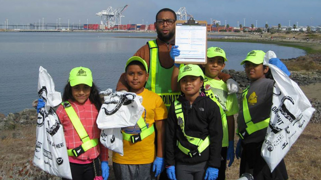 Students take part in a shoreline cleanup at the Port of Oakland's Middle Harbor Shoreline Park in Oakland, CA.