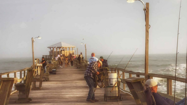 People fishing as Tropical Storm Ana approaches Oceana Pier in Atlantic Beach, North Carolina, on May 9, 2019.