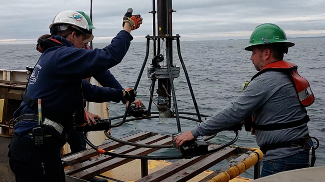 Researchers collect bottom sediment samples from the Gulf of Maine.