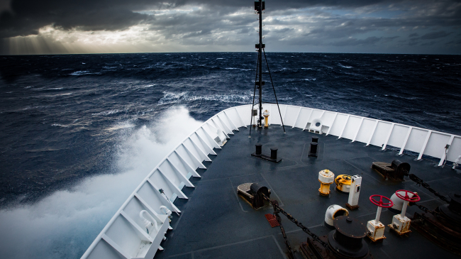 The Okeanos Explorer beats its way into heavy seas. Image courtesy of the NOAA Office of Ocean Exploration and Research, 2016 Hohonu Moana.