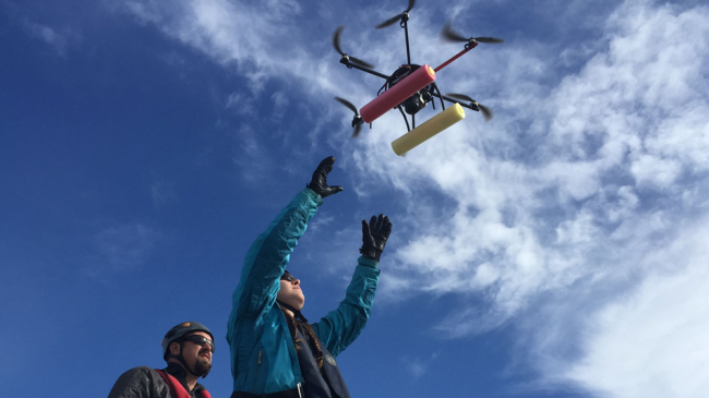 NOAA's John Durban and Holly Fearnbach release a hexacopter to photograph and gather breath samples from whales.