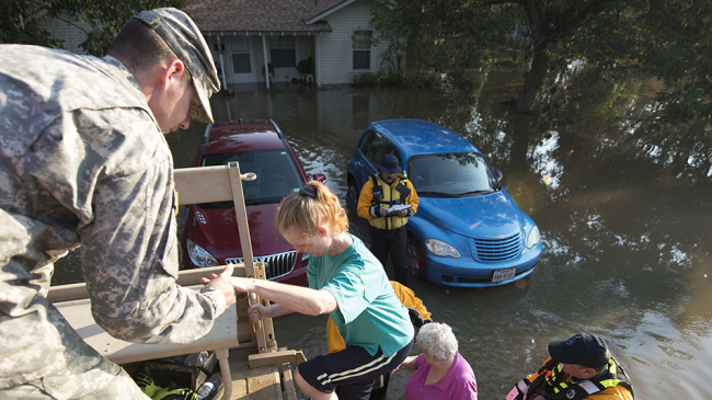 Staff Sgt. Class Richard Call, of the New Jersey National Guard, and members of New Jersey Task Force 1, assist evacuees in Wharton, Texas, Aug. 31, 2017, due to devastating effects caused by Hurricane Harvey’s aftermath.