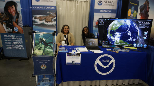 Jessica Cooper and Carolina Quijada discussing NOAA student opportunities at SACNAS 2017.