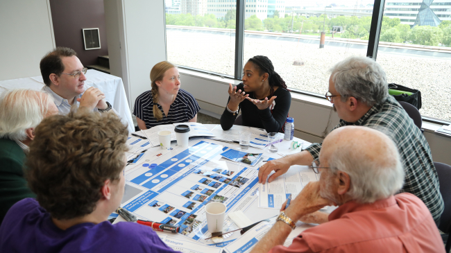 At the Boston Museum of Science, members of the public discuss ways to reduce their vulnerability to climate hazards. This project was funded by NOAA's Environmental Literacy Program. 