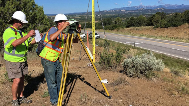 NOAA surveyors Charles Geoghegan and Benjamin Erickson conducting a geodetic surveying project in Colorado in the summer of 2017. NOAA and the National Institute of Standards and Technology (NIST) are retiring the U.S. survey foot and standardizing to now use the international foot.