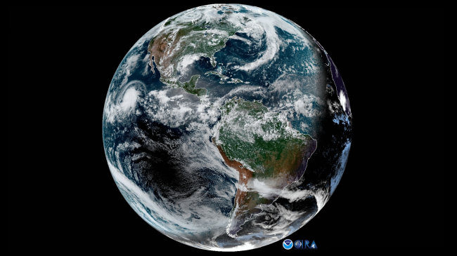 This image from NOAA's GOES East satellite on July 2, 2019 captures a variety of phenomena. Hurricane Barbara is visible in the northern Pacific Ocean while a total solar eclipse is visible in the southern Pacific Ocean. The shadow separating day and night is heavily slanted as the summer solstice occurred less than two weeks prior. 