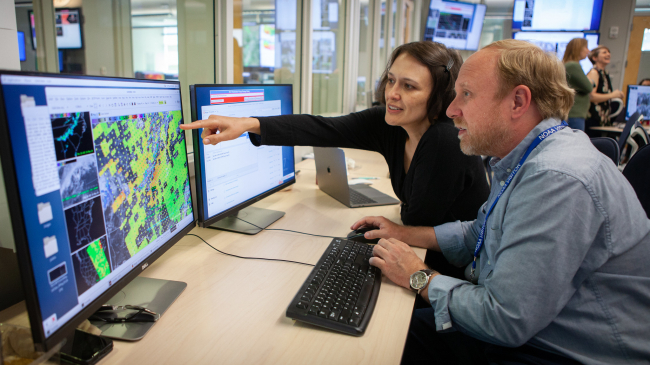 NOAA forecasters and researchers collaborate on a satellite data project at the National Weather Center in Norman, Oklahoma in 2018.