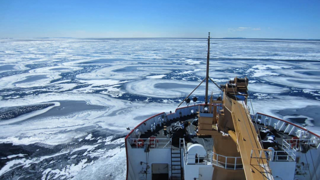 March 2014: A expansive view of broken ice cover on the open water of Lake Superior under a clear blue sky captured from aboard the U.S. Coast Guard vessel Mackinaw. The front of the vessel seen on the bottom right side of the photo. NOAA’s Great Lakes seasonal ice forecasts can be found at: https://www.glerl.noaa.gov/data/ice/#forecast⁣.
