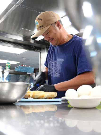 Photo of Arnold Dones, the chief steward, or chef, aboard NOAA Ship Reuben Lasker, prepares a delicious meal for the ship’s crew and scientists.