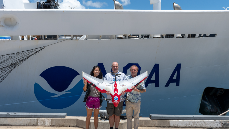 Amy Li, a 2018 NOAA Hollings scholar, with mentors Matthew Parry (center) and Rob O'Conner (right) posing with their drone outside the NOAA Inouye Regional Center. Li completed her summer internship with the NOAA Fisheries Pacific Islands Regional Office, looking at the application of Unmanned Aerial Systems for studying coral reefs.