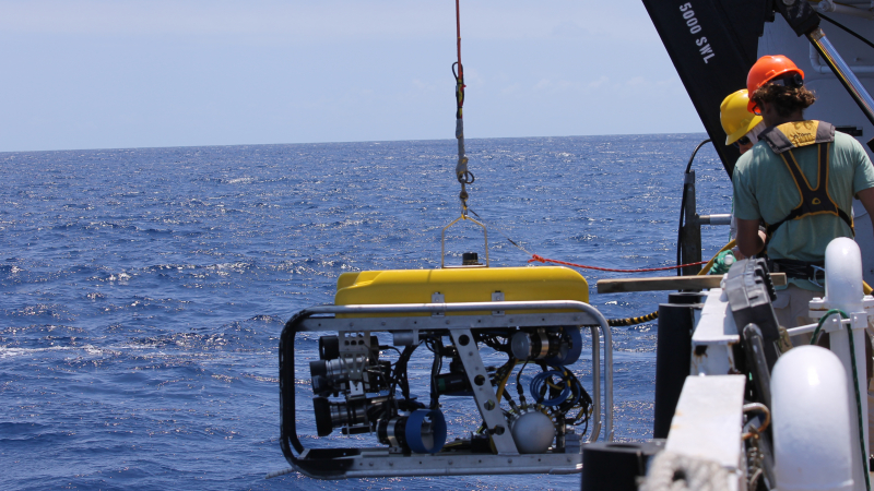 Technicians deploy a remotely operated vehicle off the side of NOAA Ship Nancy Foster in the U.S. Virgin Islands.