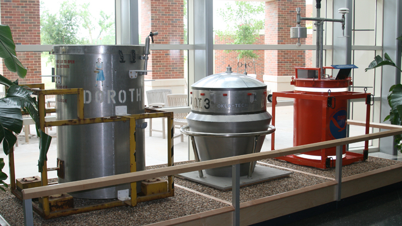 TOTO, a red 55-gallon barrel outfitted with weather sensors, was used by NOAA researchers to study tornadoes. Dorothy and D.O.T.3 are props based on TOTO and were used in the movie “Twister.” All three are on display at the National Weather Center in Norman, Oklahoma.
