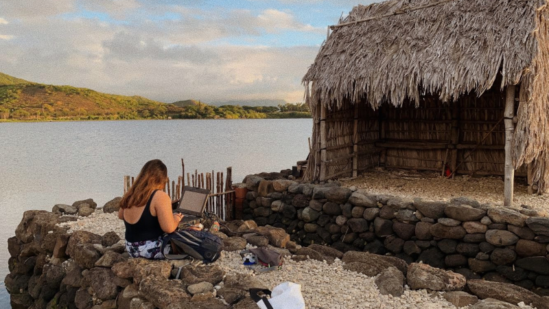 Diana Lopera, a 2018 NOAA Hollings scholar, enjoys the views of PaepaeHale — one of Diana's offices during her summer internship. This lone restored hale (traditional house) overlooks the traditional Native Hawaiian Heʻeia Fishpond.