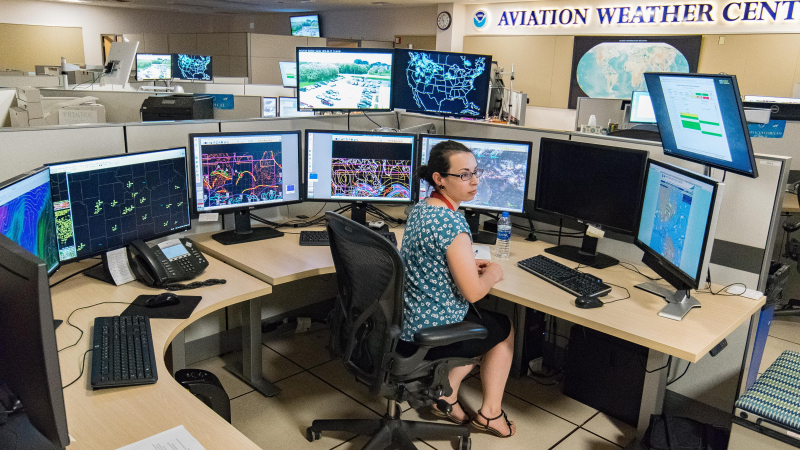 NOAA Aviation Weather Center senior meteorologist Amanda Martin monitors weather conditions and air traffic in real-time from several computer monitors.
