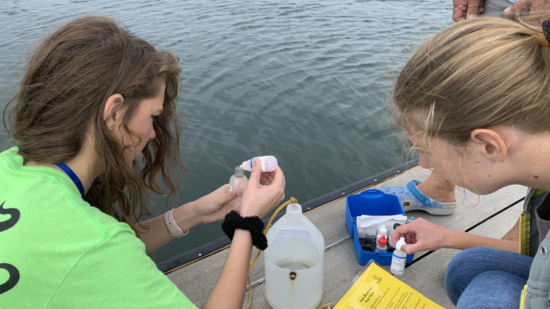 ACT students conduct a dissolved oxygen analysis at the Navarre Beach Boat Ramp.