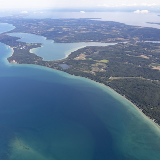 An aerial photo of northern Lake Michigan near Sleeping Bear Dunes National Seashore. NOAA scientists are teaming up with Viking Cruises to conduct research onboard Viking ships touring the Great Lakes starting in 2022.