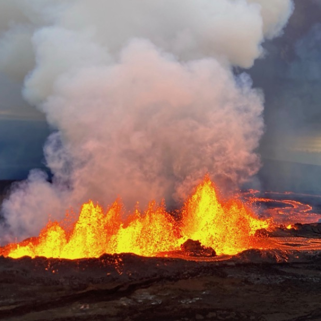 This aerial photograph shows the dominant fissure erupting on the Northeast Rift Zone of Mauna Loa, taken at approximately 8 a.m. Hawaii Standard Time on November 29, 2022. Lava fountains were up to 25 m (82 ft) that morning and the vent was feeding the main lava flow to the northeast.